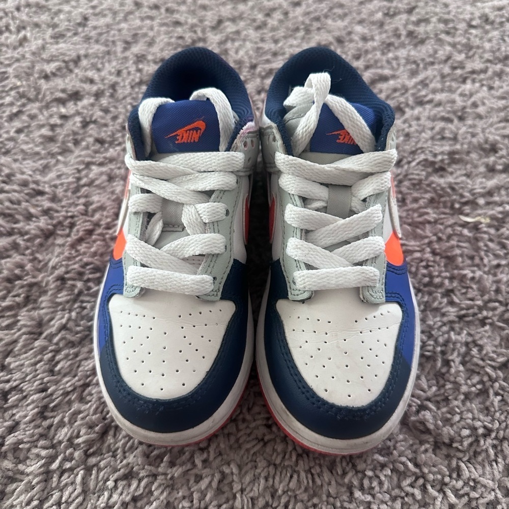 Preloved Nike Kids Navy and White Sneakers with Orange Accents
